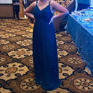 Selling this long Dress, it has an opening in back